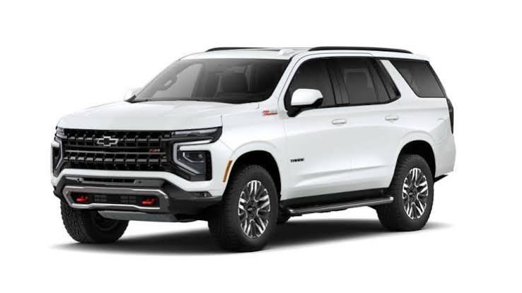 JRD's white Chevrolet Tahoe, shown from the front and side